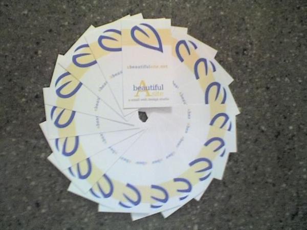 A number of business cards layed out in a circle